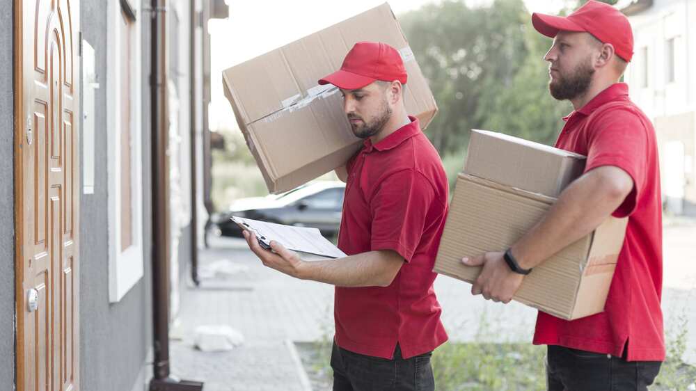 front-view-delivery-man-with-packages