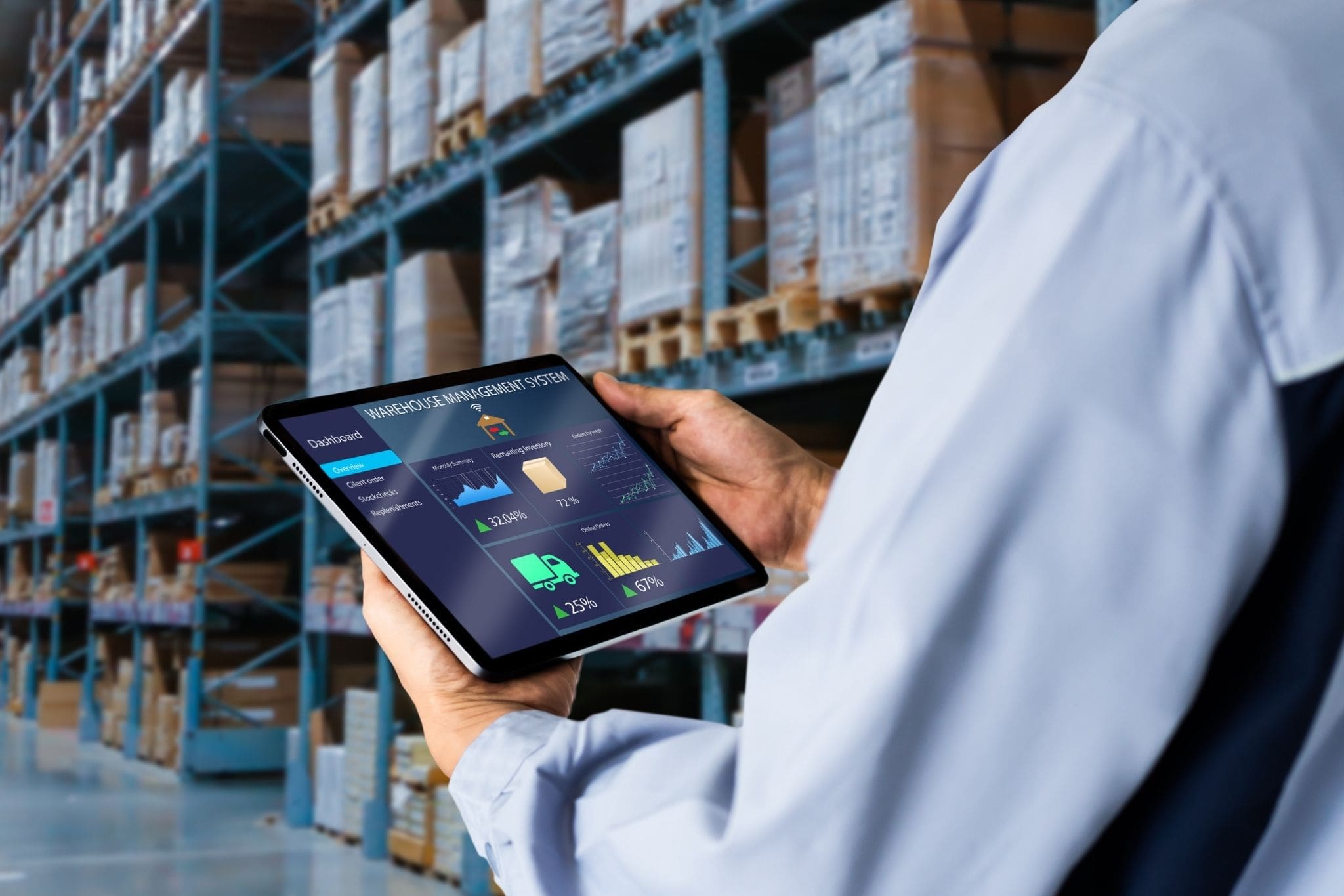 employee using tablet in checking warehouse