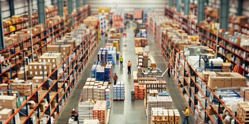 warehouse with organize inventory workers using handheld scanners